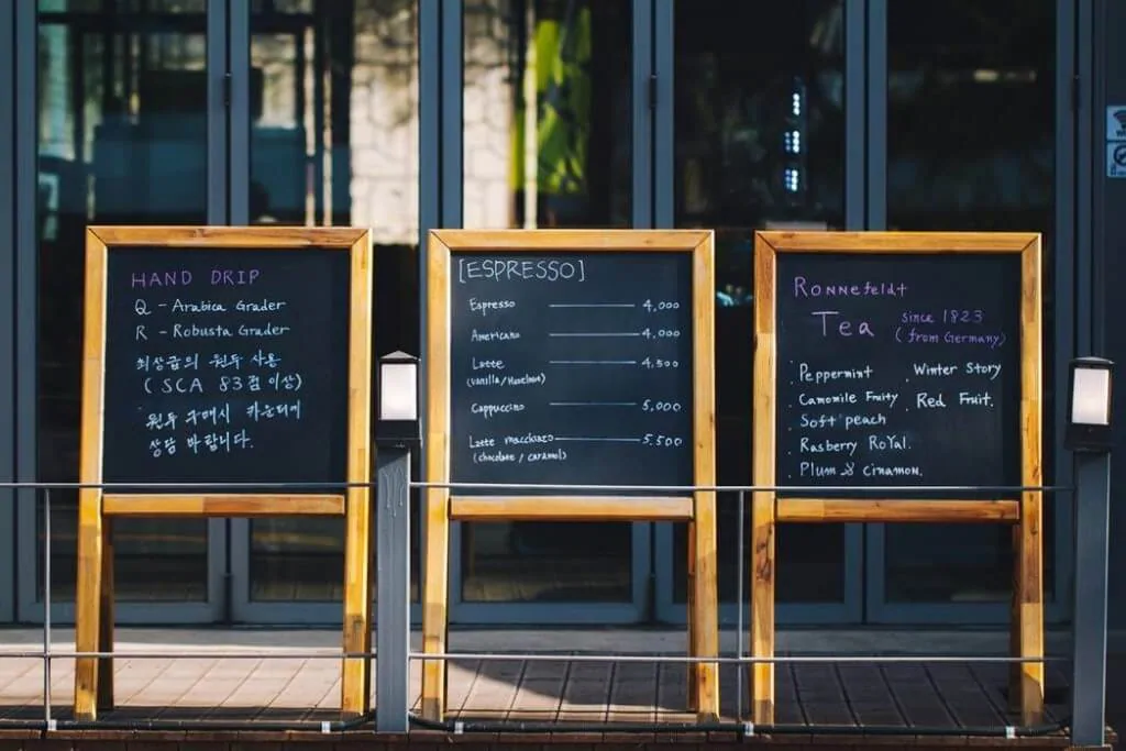 different pricing and marketing strategies are shown on a coffee shop menu