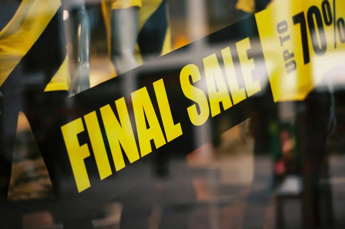 a retail store displays a 'final sale' sign in a window in order to quickly sell slow-moving inventory