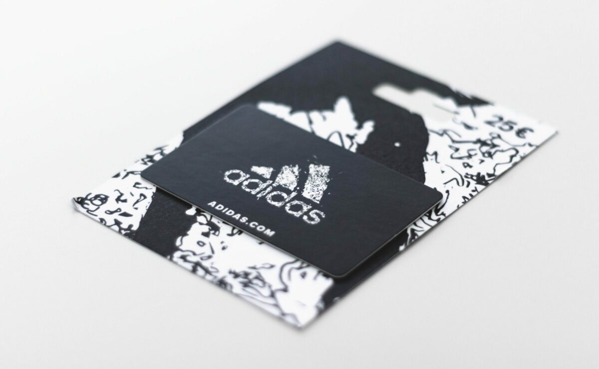 an Adidas gift card with design and branding