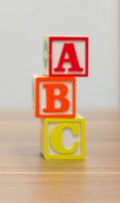 children's toy building blocks spell out 'ABC'