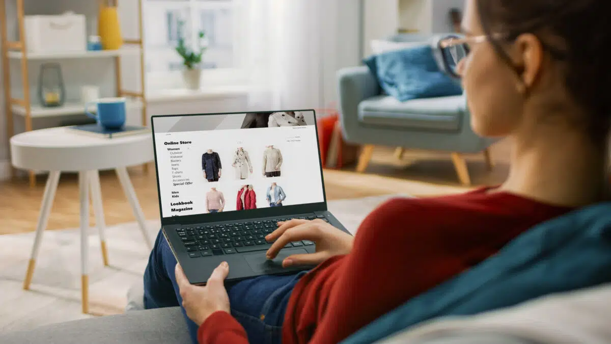 a shopper uses a customer friendly eCommerce site to shop for clothes on their laptop