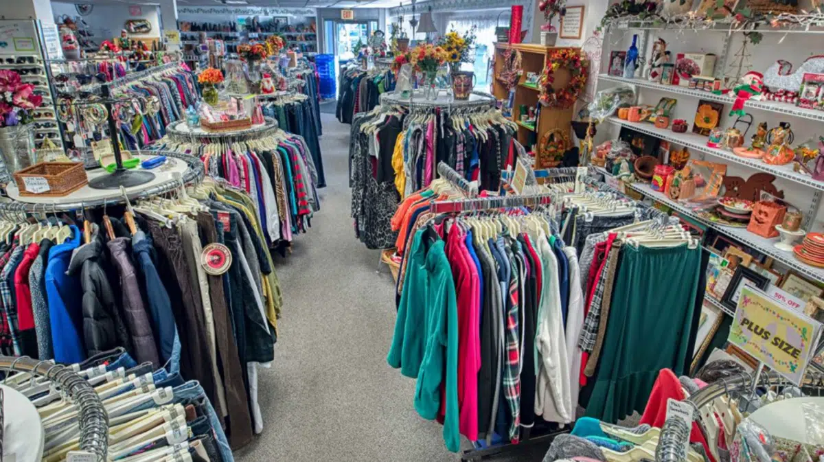 a thrift store with racks of clothing and other goods