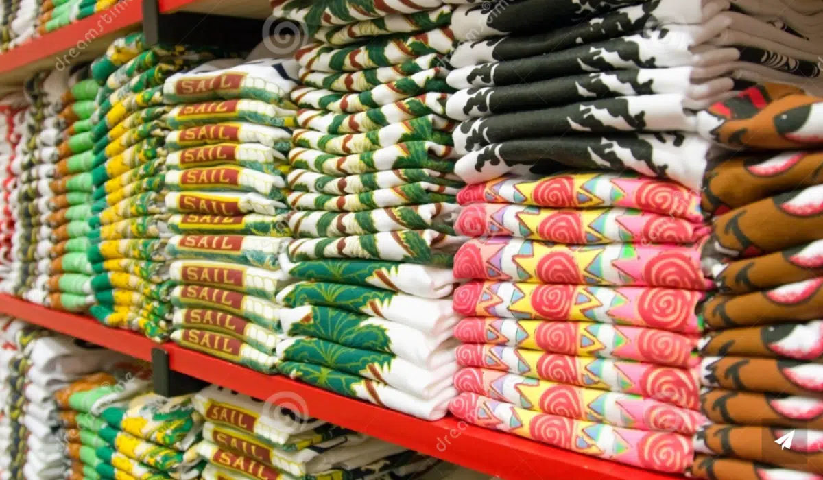 t-shirts are folded neatly on a store shelf