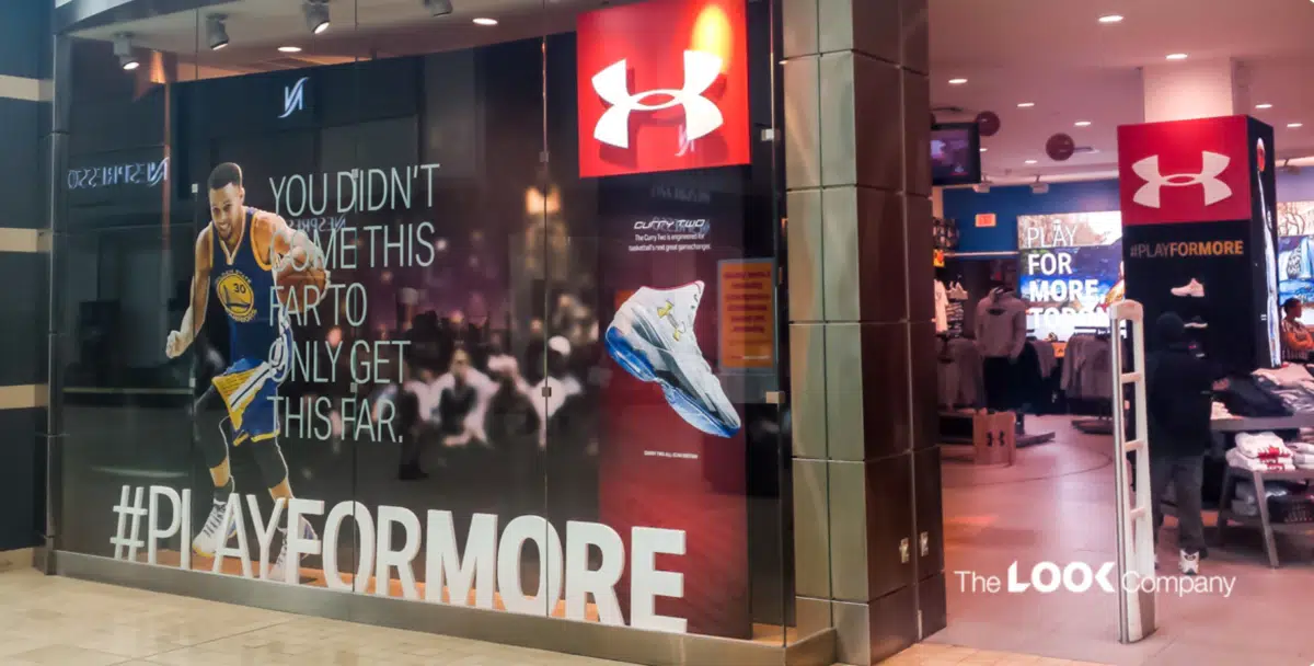 Under Armour store window display showing Steph Curry 