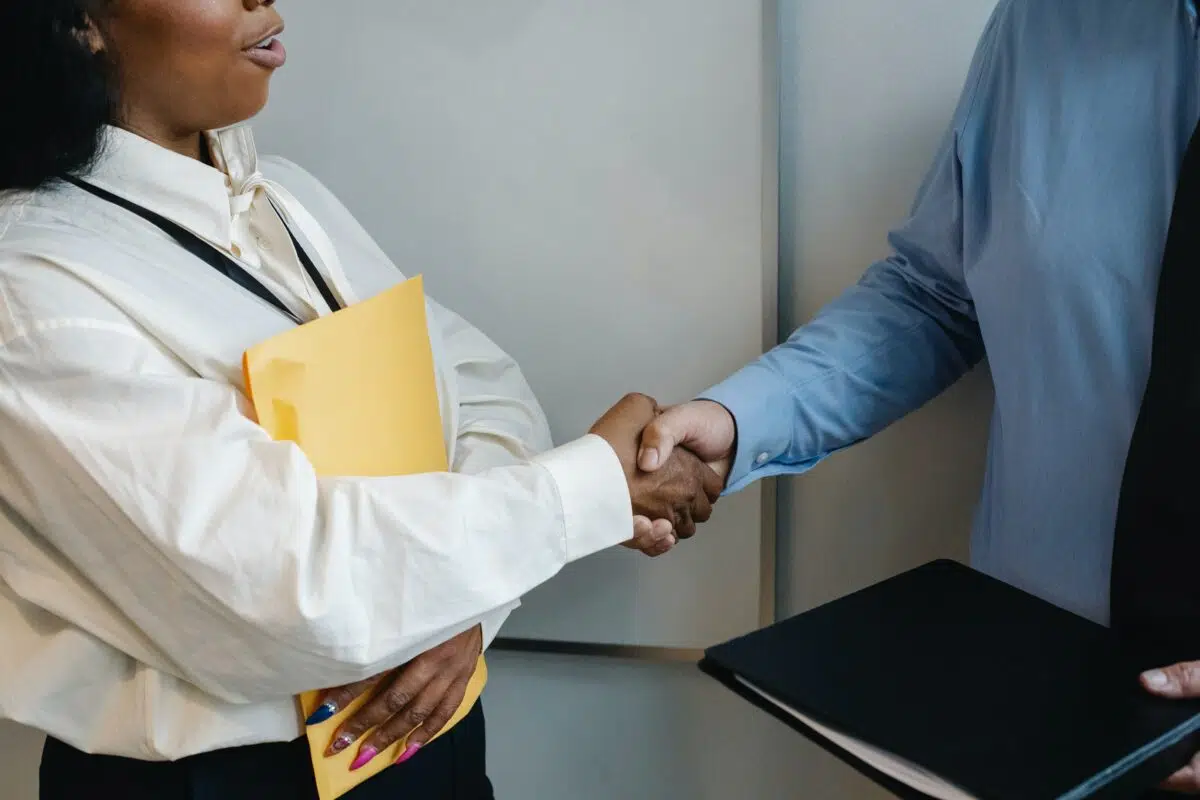 two businesspeople shake hands