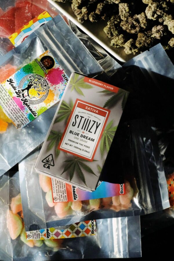a photo showing various cannabis products including edibles and flower
