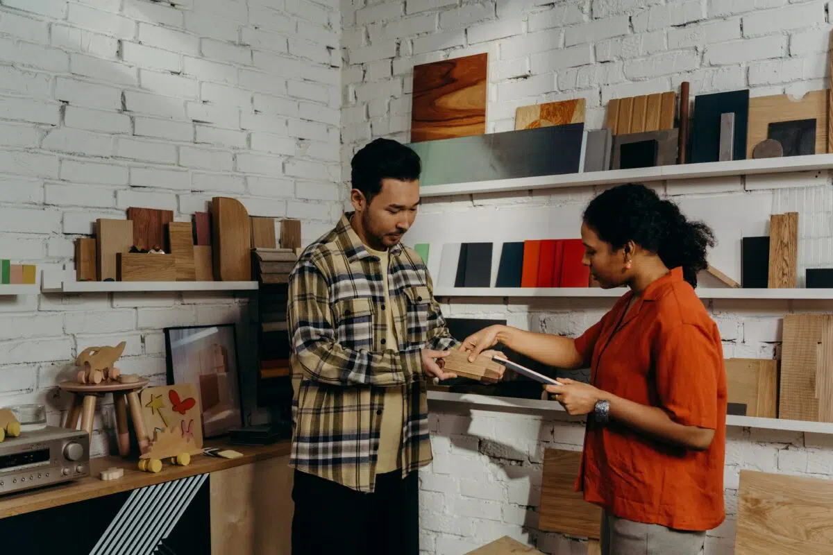 a salesperson helps a customer in a retail store