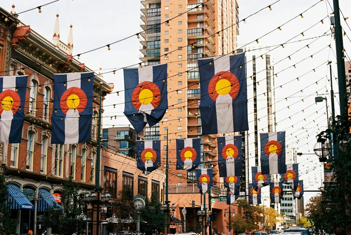 downtown Denver, Colorado with Colorado flags hanging