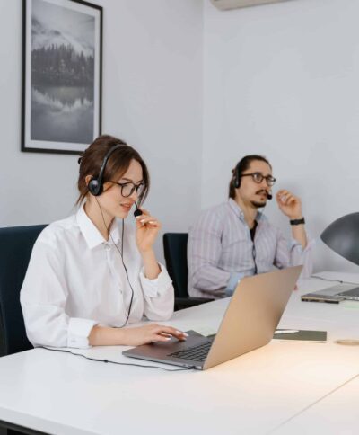 technical support team members talk to clients on the phone