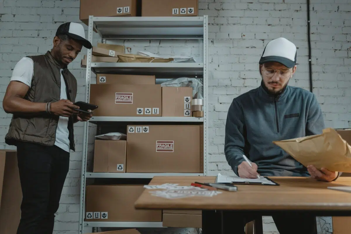 two dispensary workers look over their inventory