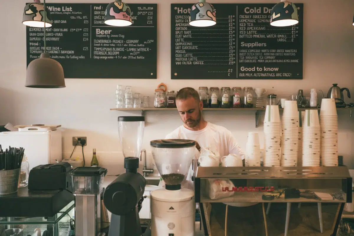 a barista uses an espresso machine 