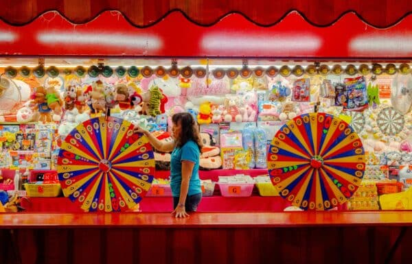 an amusement park rewards booth filled with prizes and toys