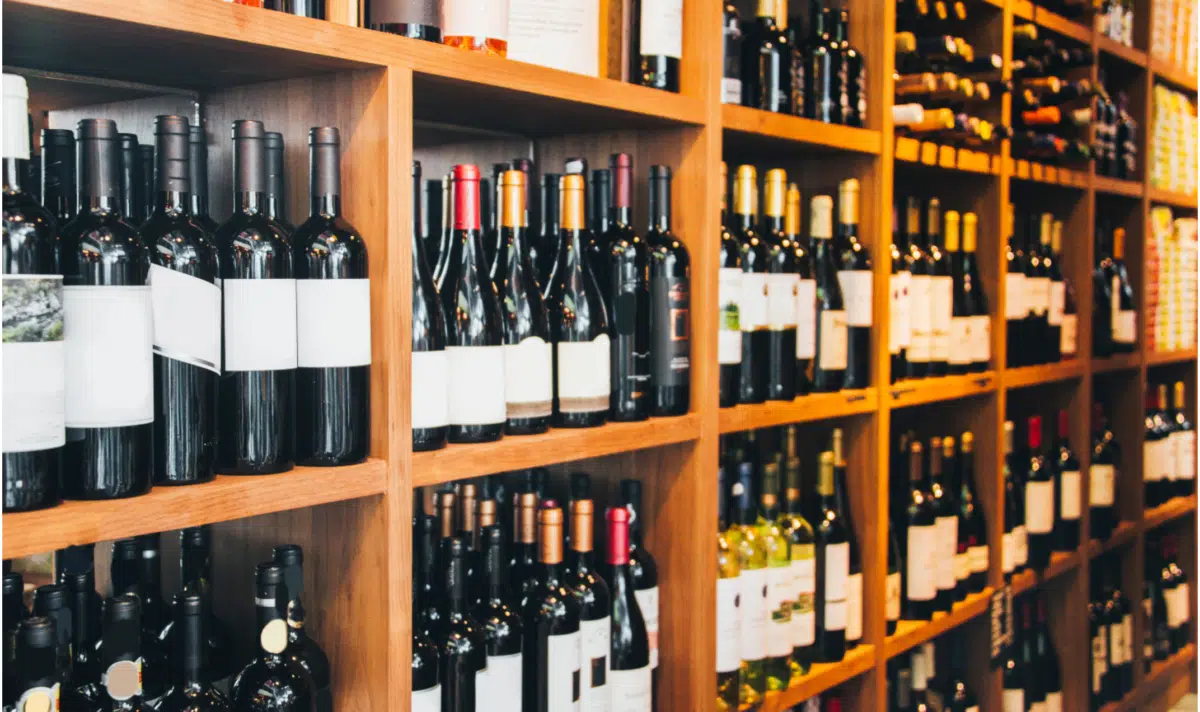 liquor store shelves stocked with wine bottles