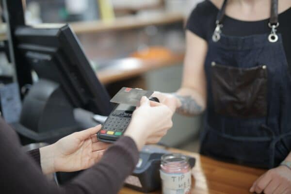 a customer in a dispensary uses a credit card to make a purchase
