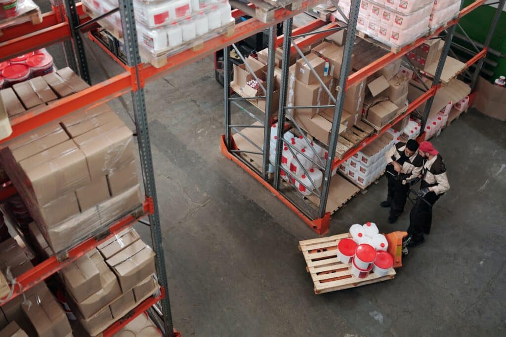 two employees perform inventory valuation in a warehouse