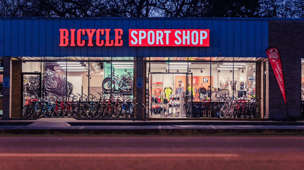 Exterior or a popular bicycle shop with large windows displaying many road bikes