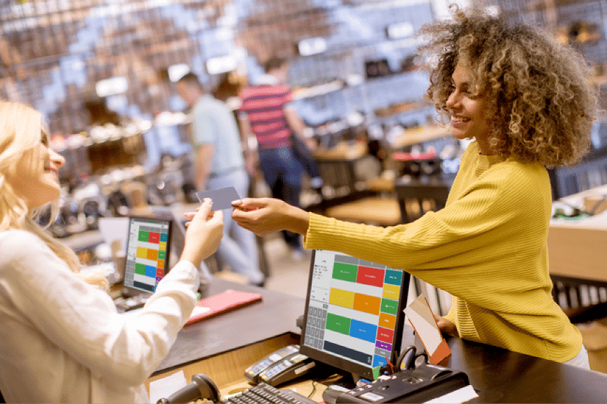 Picture illustrating a woman at the checkout of a retail store.