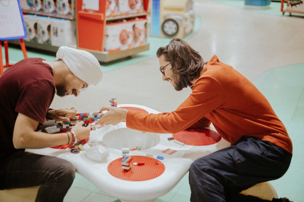 an example of experiential retail with two friends playing with Lego's in a store