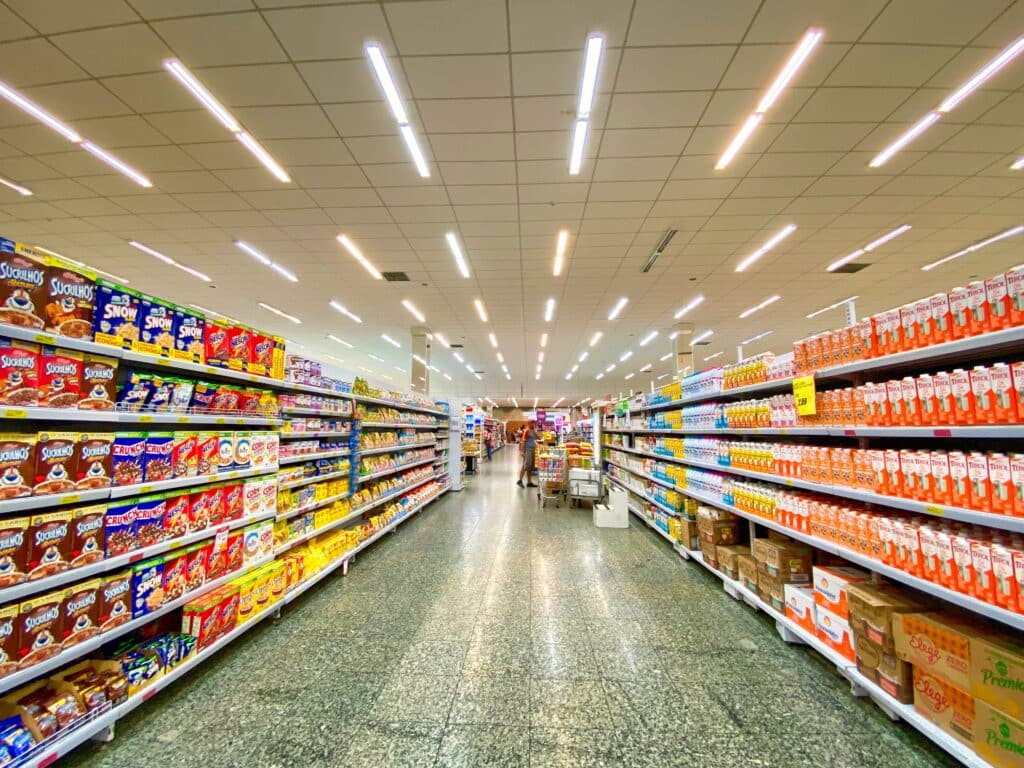 Image of a retail store aisle with many color coordinated products