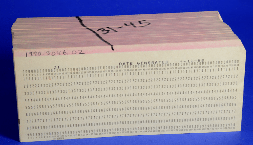 A stack of old employee punch cards
