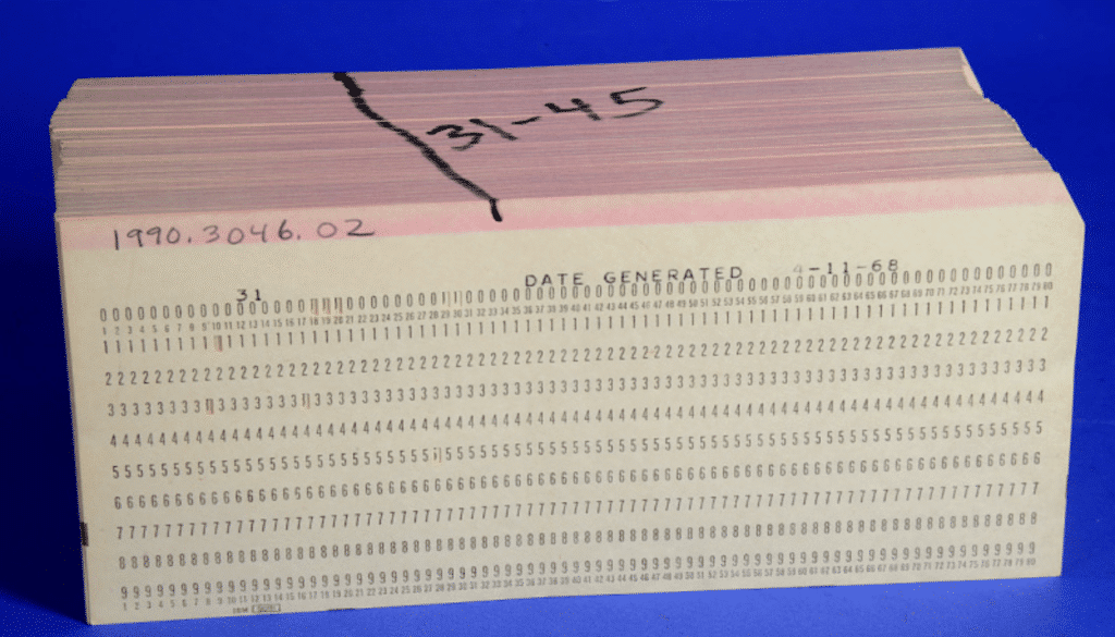 A stack of old employee punch cards