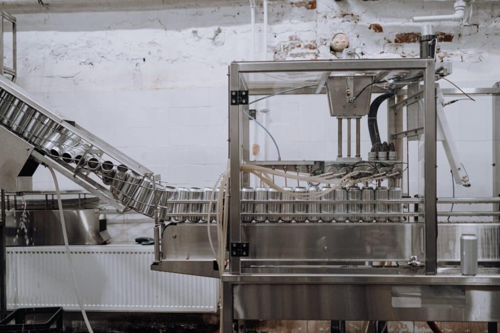 a machine in an assembly line of a beer can manufacturer