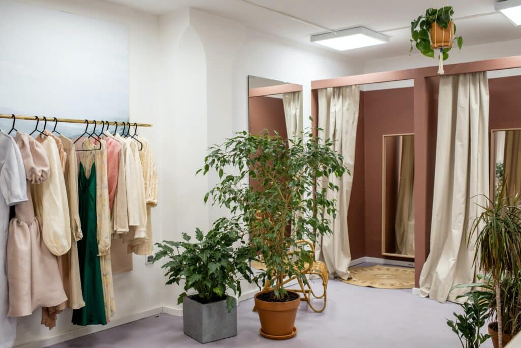 an example of retail design trends with plants in a clothing store