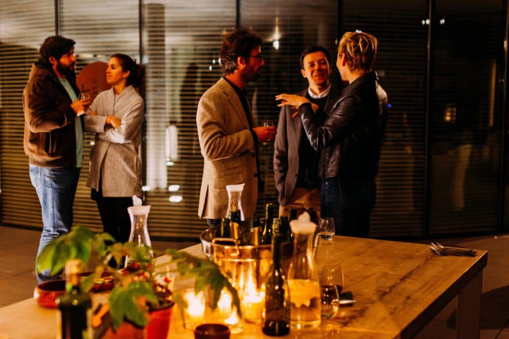 retail customers chat and enjoy wine at a retail event