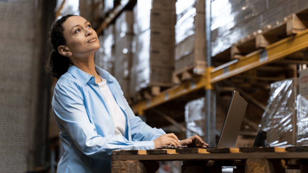 automated inventory management featured image showing a retail manager using a laptop in a warehouse