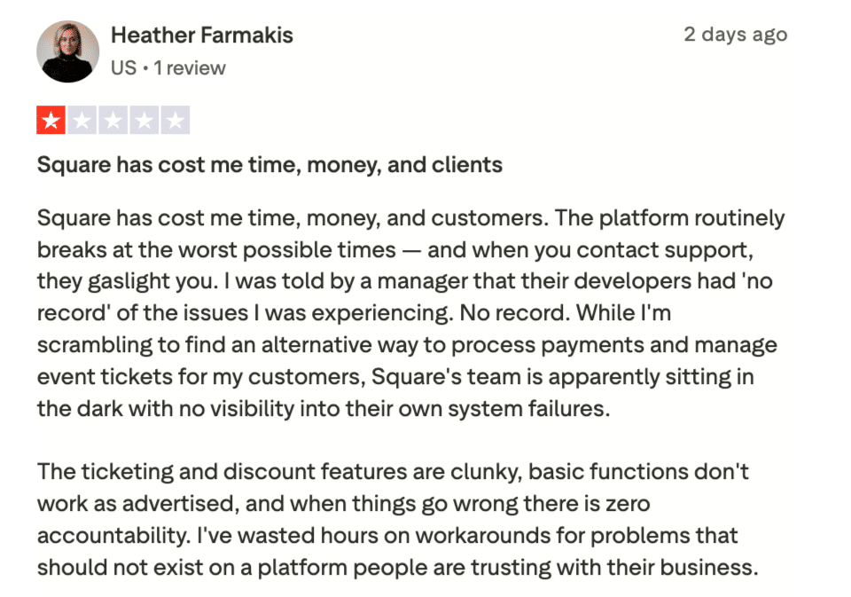 Screenshot of a 1-star Trustpilot review from Heather Farmakis describing repeated platform outages, clunky ticketing features, and unresponsive support that denied any knowledge of ongoing system failures.