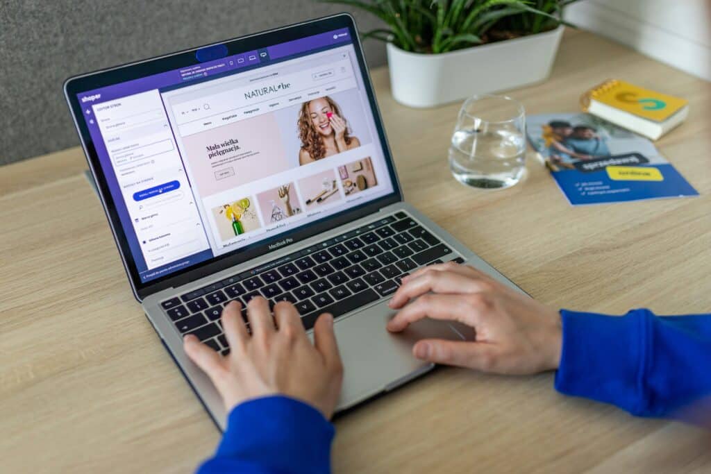 Person uses a laptop to shop online for cosmetic products